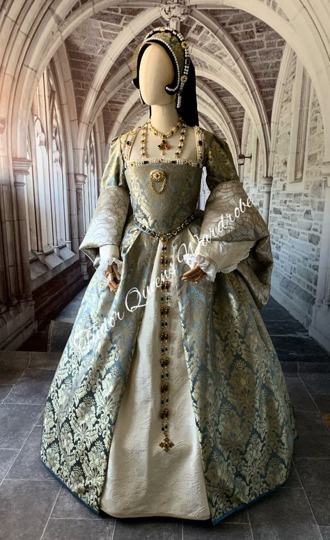 Blue & Gold Historically accurate constructed Tudor Gown. Personally made by me in my workshop in the Cotswolds, England. Machine sewn but hand finished .  Comprising of: 🌹Cream jewelled damask Kirtle with matching lower sleeves with silk pull throughs and cuffs. 🌹Blue and gold damask overgown 🌹Farthingale (hooped skirt) 🌹Full jewelled French Hood (Jewellery NOT included, but can be added to order if required. Comprising of Necklace set, brooch & Girdle belt) Bespoke made to order. Please no Tudor Gown, The Cotswolds England, Girdle Belt, Tudor Dress, Historical Gowns, Tudor Fashion, Cotswolds England, Medieval Gown, The Tudors