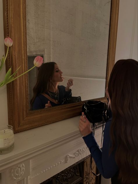 Girl with long brown hair applying lip gloss in large mirror wearing long sleeve blue top, layered jewelry Aesthetic Brunette, Pic Mirror, Low Exposure, Brunette Makeup, Typo Design, Long Dark Hair, Jewelry Mirror, Mirror Pic, Layered Jewelry