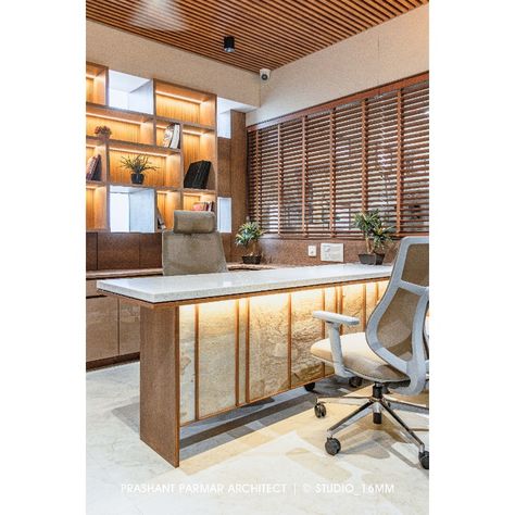 Considering the Doctor’s Conveniency, The OPDs are tactfully placed in such a way that it remains visually connected with the NICU, Nursing Station, Emergency Room & Reception area as well without losing the privacy of the doctor. The table is adorned with Stone Veneer, Teak wood, & Corian Top. Initially, The backdrop wall had a cluster of small windows. But we smartly designed a floating book shelf without enclosing the windows. Doctor Clinic Interior Design, Doctor Table Design, Doctor Room Design, Small Reception Table, Doctor Table, Floating Book Shelf, Nursing Station, Prashant Parmar, Corian Top