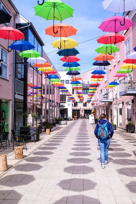 Brightly coloured umbrellas in Vejle, Denmark Aarhus, Vejle, Umbrella Street, Copenhagen Travel, Denmark Travel, Latin Quarter, Pedestrian Street, Quirky Art, Mystery Of History