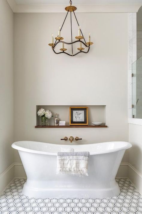 Choros Chandelier above a freestanding vintage roll-top bathtub and a niche for bath essentials and decorative accents. Transitional Bathroom Design, Wall Faucet, Vintage Tub, Bathtub Decor, Timeless Bathroom, Bathtub Walls, Roll Top Bath, Transitional Bathroom, Master Bath Remodel