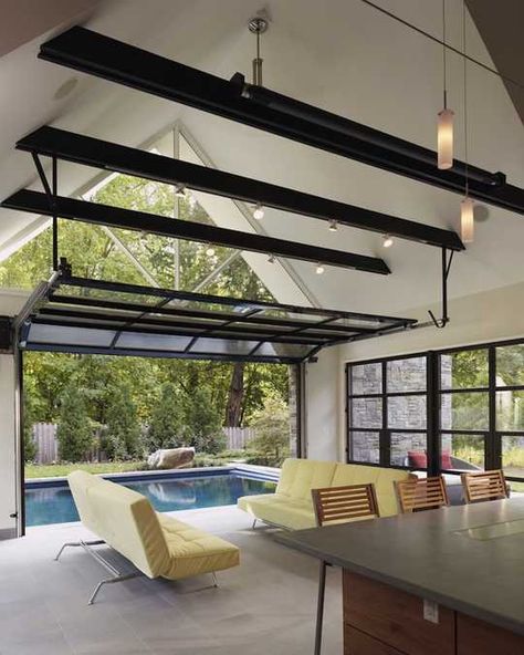 Home indoor outdoor pool | ... pool house design connecting home interiors and outdoor swimming pool Pool House Design, Pool House Designs, Glass Garage Door, Home Design Magazines, Indoor Outdoor Pool, Home Addition, Indoor Swimming Pools, Contemporary Living Room, Sliding Glass Door