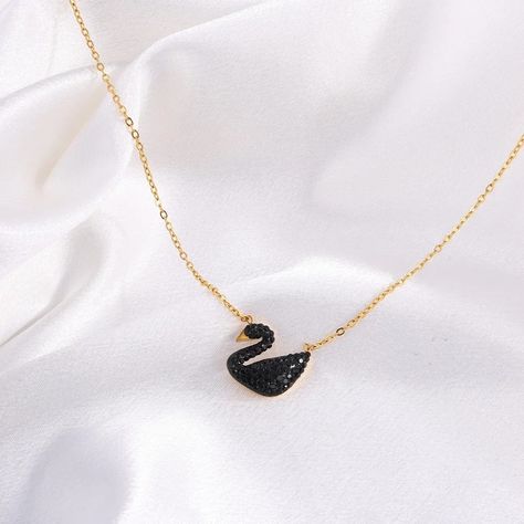 Elegant Black Swan Pendant Necklace - A Symbol of Grace and Beauty 🖤✨ Embrace the elegance of this stunning black swan pendant necklace, crafted to symbolize grace, beauty, and transformation. The delicate gold chain perfectly complements the bold black swan adorned with sparkling crystals, making it the ideal accessory for any occasion. Whether you're dressing up for a night out or adding a touch of sophistication to your everyday look, this piece will surely captivate attention. Shop now a... Swan Pendant, Symbol Of Grace, Grace Symbol, Delicate Gold Chain, Grace Beauty, Birthday Items, Chains Necklaces, Necklace Black, Black Swan