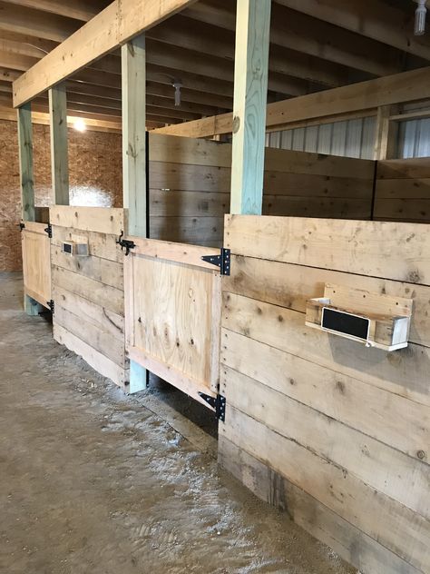 The stalls in our new horse barn with brush holders on each stall and chalk board on the front to write their names. It will also have hooks under the holder for their halter. Wood Horse Stalls, Simple Horse Stalls, Stall Door Ideas, Diy Stall Fronts, Horse Stall Design, Horse Barn Stalls Ideas, Small Stable Ideas, Horse Stall Ideas Cheap, Diy Stables For Horses