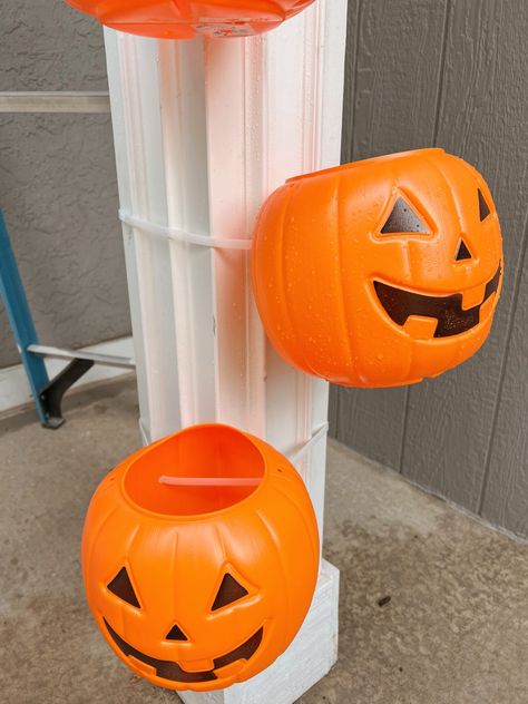 How I Used Plastic Pumpkins to Decorate a Porch - traditionallycozy.com Plastic Pumpkin Outdoor Decor, Stacking Plastic Pumpkins Porch, Plastic Pumpkin Tower Diy, Plastic Pumpkin Arch, Diy Fall Decorations Outdoor, How To Weigh Down Plastic Pumpkins, Pumpkin Pail Crafts, Plastic Pumpkin Decorating Ideas, Plastic Pumpkins Bucket Arch