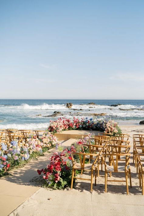 Amidst the stunning Sea of Cortez, the couple exchanged vows in a cozy beach ceremony, surrounded by gorgeous blossoms in every direction. | Image by MC Wedding Simple Beach Ceremony Decor, Small Wedding Beach, Pastel Beach Wedding, Beach Wedding Aisle, Pink Beach Wedding, Spring Beach Wedding, Wedding Ceremony Decoration, 2025 Bride, Beach Wedding Pink