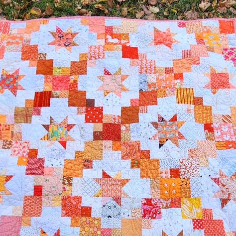 Stephanie | pattern designer & scrap quilter on Instagram: "I realized I never showed off my finished Brightly quilt! I did another low key sew along with some friends and we picked this pattern because it works for scraps and layer cakes. Mine is orange & Low Volume (absolutely inspired by @novaquilts star quilt she made ages ago that I've always loved) Some of the oranges came from Canada, Australia, and Germany!! Thank you to everyone who offered to trade scraps with me 🥰🥰 . Pattern by @cluckclucksew #BrightlyQuilt #SilverSideShugQAL" Brightly Quilt, Orange Quilts, Cluck Cluck Sew, Heather Bailey, Orange Quilt, Two Color Quilts, Quilting Board, Layer Cakes, Some Friends