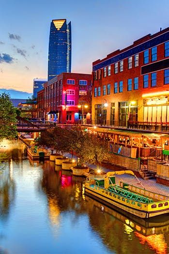 The 10 Coolest Cities with the Lowest Cost of Living in the U.S. #purewow #real estate #money #moving #travel #domestic Cute Towns In America, Prettiest Cities In The Us, American Cities Aesthetic, Willow City Loop Texas, Oklahoma City At Night, Bricktown Oklahoma City, Oklahoma City University, Cheap Places To Travel, Oklahoma City