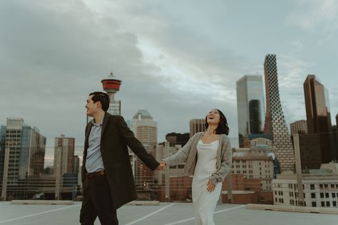 On a warm February evening, amidst the vibrant cityscape of downtown Calgary, Camille and Jamie celebrated their love in a unique and... Calgary Downtown, Downtown Couple, Nyc Shoot, Urban Elopement, Street Couple, Downtown Calgary, Rooftop Engagement, Night Shoot, Calgary Alberta