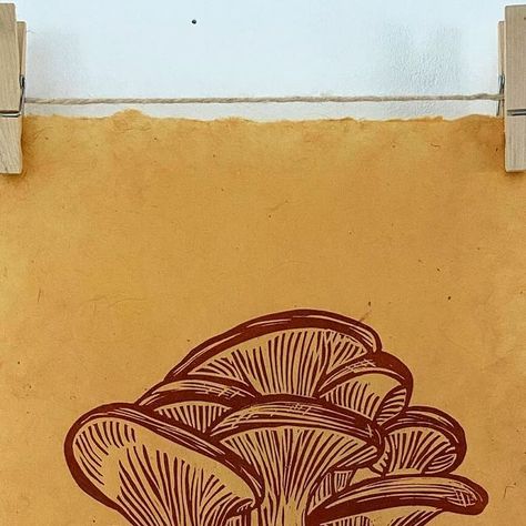 Jill Dunn - Printmaker on Instagram: "Oyster mushrooms… i’m awaiting delivery of some gorgeous light mushroom-brown linen to print these on to… but in the meantime I thought I’d try some Burnt Sienna on Turmeric paper… what do you think? I think they’d look great in wooden picture hanger so you could see the paper edges…. I’ll be listing them in my shop in a bit! #mushrooms #oystermushrooms #linocut #printmaking" Mushroom Graphic Design, Mushroom Brown, Linocut Printmaking, Lino Art, Oyster Mushrooms, Picture Hanger, Burnt Sienna, Wooden Picture, Picture Hangers