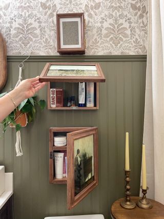 This Hidden Storage Hack is the Best Way to Disguise Unsightly Stuff in Plain Sight, and it's Easy to DIY Hidden House Storage, Toilet Diy Ideas, Creative Home Organization, Hidden Picture Frame Storage, Tiny Bathroom Hacks, Hidden Shelves In Wall, Inside Wood Storage Ideas, Cute Bathroom Storage Ideas, Hidden Paintings In House