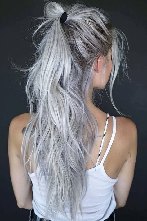 From the cute flowy silver ponytail you see here to messy updos and long loose waves, there are a ton of beautiful hairstyles for silver hair. Click through for 40+ hottest silver hair ideas and save your favorites! Silver Hair With Curtain Bangs, Silver Tipped Hair, Blonde Silver Hair Color Ideas, Bright Silver Hair, Silvery White Hair, Bright White Hair, Long Silver Hair With Bangs, Light Colored Hair Ideas, Asian Silver Hair