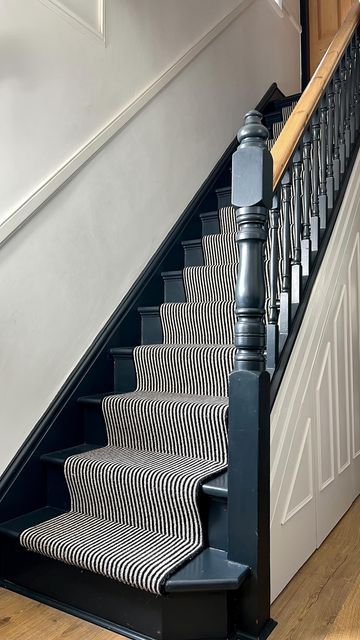 Painted Stripes On Stairs, Stripy Stair Carpet And Landing, End Of Stairs Ideas, Navy Staircase Banister, Charcoal Bannister, Farrow And Ball Railings Stair Bannister, Dark Stairs Carpet, Black And White Striped Stair Runner, Painted Stairs And Runner