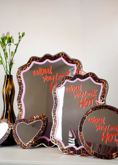 Wow - You Look HOT! And don't you forget it - self love reminder with our leopard print and lippy disc mirror! Each mirror features a colourful & fun design with a positive message to make you feel FAB or we can all relate too! They look great on your dressing table, wall, or even the perfect gift. Available in either mini 15cm or 30cm sizes Acrylic mirror No hanging on the back Recommend hanging using a small command strip or white tack. Cheetah Mirror, Neon Sign Above Mirror, Diy Leopard Print, Hollywood Glam Room Decor, Words On Mirror Aesthetic, Cute Wall Mirror, Leopard Office, Girly Eclectic Decor, Colorful Apartment Ideas