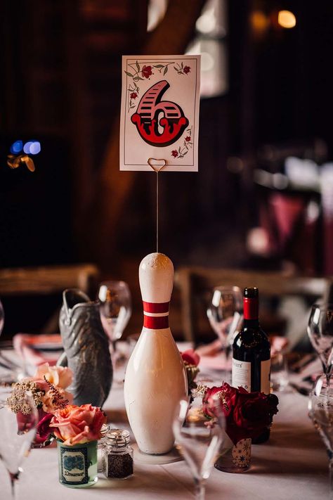 Fun bowling pin wedding table centrepiece with table number sign Bowling Wedding Reception, Bowling Alley Wedding, Fairground Wedding, Bowling Wedding, Carnival Wedding Theme, Wedding Table Centrepieces, Midnight Circus, Retro Wedding Theme, Wedding Table Centrepiece