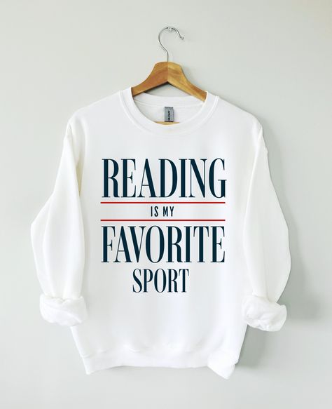 Hey Book lover, show off your love for Reading Books with our Reading is my favorite sport sweatshirt. The perfect gift for Readers, Librarians, Bookworms, Book Addicts, Book Nerds and Book Lovers.  All designs are available on tshirts/sweatshirts/hoodies. Send me a message if you can't find the product you need! MATERIAL ✨ Sweatshirt sizes are Unisex, please refer to sizing chart in listing photos ✨ 50% cotton, 50% polyester �✨ Medium fabric weight ✨ DTG Printed CARE ✨ Machine wash: warm (max 40 Book Lover Tshirt Design, Book Lover Shirt Ideas, Love Reading Quotes, Book Sweatshirts, Book Sweater, Reading Sweatshirt, Book Nerd Shirts, Book Clothes, Sports Sweatshirts