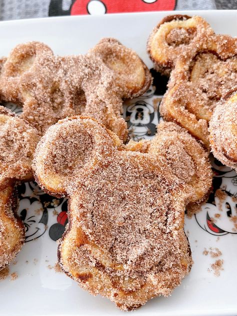 Get ready to elevate your breakfast game with the mouthwatering delight of Churro Mickey waffles. Imagine crispy-on-the-outside, fluffy-on-the-inside Mickey-shaped waffles coated in a heavenly blend of cinnamon and sugar. And the best part? You can get these on a Disney Cruise or theme parks, or with this easy recipe, you can now recreate this delectable treat in the comfort of your own kitchen. Disney Brunch, Disney Waffle Recipe, Mickey Churro Waffles Recipe, Mickey Mouse Waffle Recipe, Mickey Churro Waffles, Disney Churro Waffles, Gluten Free Churros, Disney Breakfast, Churro Waffles