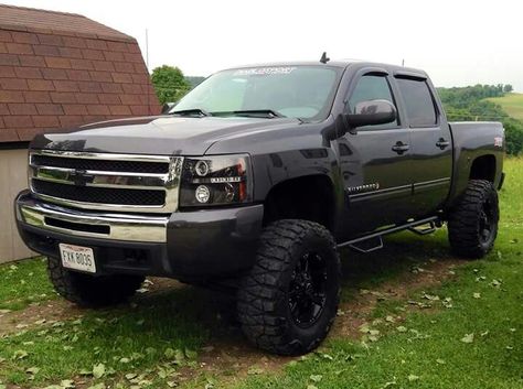 Grey and black and a touch of chrome. Chevy Silverado 2012 Chevy Silverado, Denali Truck, Chevy Trucks Silverado, Silverado Truck, 2013 Chevy Silverado, 2007 Chevy Silverado, Lifted Chevy, Lifted Chevy Trucks, Jacked Up Trucks