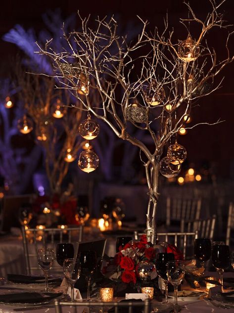 49 Winter Wedding Centerpieces That Celebrate the Season Tree Centrepiece Wedding, Floating Tea Candles, Winter Wonderland Wedding Centerpieces, Labyrinth Wedding, Tree Centrepiece, Mercury Glass Centerpiece, Centrepiece Wedding, Christmas Wedding Centerpieces, Candlelit Wedding