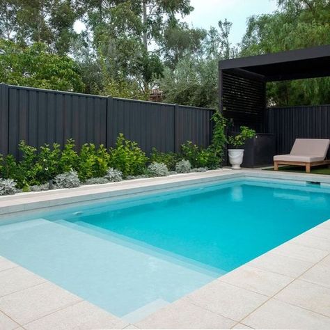 An astonishing transformation of an old concrete pool and spa in an early 1900s heritage home into a dazzling contemporary masterpiece. Showcasing the divine white pearl tiles that glimmer in the sun's reflection, perfectly complemented by the seamless style of the coconut drift drop face porcelain and the bold greens of the surrounding lawn and plants. Intrinsically designed, meticulously prepared, the transformation is one to behold. Luxurious Swimming Pools, Pool Fencing Landscaping, Plants Around Pool, Garden Pool Design, Pearl Tiles, Divine White, Pool Paving, Old Concrete, Pools For Small Yards