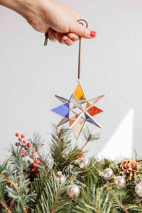 Add a sparkling and enchanting touch to your space with this beautiful handmade glass star. This 3D star in bright multi colors can be hung or placed, giving you flexibility in how you present it. Whether you use it as a dazzling piece of Christmas decoration or gift it as a meaningful present, this star is sure to capture attention. 🌟 Key Features: This unique star is lovingly handcrafted with attention to detail and craftsmanship. The colors of the glass beautifully captures the light, creati Moravian Star, Christmas Star Decorations, Stained Glass Ornaments, 3d Star, Stained Glass Window Hanging, Stained Glass Christmas, Glass Stars, Stained Glass Flowers, Stained Glass Crafts