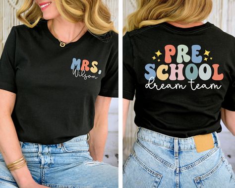 You will have the most stylish teacher team in the school with these shirts! This is also a great gift for a new teacher.  Leave the name you would like in the box provided SIZE UP 1-2 SIZES FOR THAT OVERSIZED LOOK   Thanks so much for shopping with me! Please message me with any questions you may have! I am always available to help :) Also, I would love to feature you on our insta if you want to tag me @poppyroseclothing    PRODUCTION TIME: 1-3 business days    SHIPPING TIME: 2-5 business days   PRODUCT DESCRIPTION: Bella Canvas Unisex T-shirt Super soft cotton and excellent quality print makes. 100% Soft cotton (fibre content may vary for different colors) Light fabric (4.2 oz/yd² (142 g/m Runs true to size CARE INSTRUCTION: Machine wash: cold,  Tumble dry: low heat, do not iron directly Prek Teacher Shirt, Teacher Name Shirt, Preschool T Shirts For Teachers, Tshirt Teacher Outfits, Preschool Shirt Ideas, Preschool Teacher Tshirt Ideas, Preschool Teacher Tshirts, Prek Teacher Shirts Designs, Preschool Teacher Shirts Designs