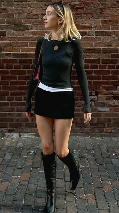 Nora Clark Outfits, Fyre Campus Boots Outfit, Knee Length Black Boots Outfits, Mini Skirt And Knee High Boots, Sweater With Mini Skirt Outfit, Classy 2000s Outfits, Low Rise Long Skirt Outfit, Long Sleeve Mini Skirt Outfit, Night Out In London Outfit