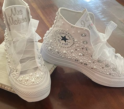 These are the Platform Hi top from CONVERSE.  I use pearls  on the toe and along  the side, with a few down the back. I also scatter in some rhinestones. I can change colors of rhinestones if you want but will do silver unless you specify a different color.  Great Wedding shoes too, put Mrs(last name on one tongue. I do with date on other. Embroidery can be changed too.  Having a party?  What a great idea. Sweet 16, Bat Mitzvah or any special occasion! Let's add some BLING to your day. How prett Sneakers Bride, Wedding Tennis Shoes, Bling Sneakers, All White Shoes, Reception Shoes, Custom Wedding Shoes, Converse Chucks, Converse Platform, Top Pearl