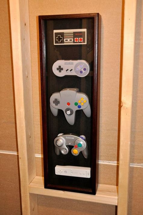 15 Cool Ways To Video Game Controller Storage | Home Design And Interior Sala Nerd, Geek Home Decor, Wall Display Case, Geek Room, Nerd Room, Nerd Cave, Nintendo Controller, Video Game Rooms, Geek Decor