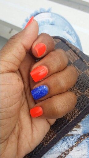 Neon orange and royal blue nails #nextgeneration Navy And Orange Nails Design, Blue N Orange Nails, Blue And Orange Short Nails, Short Blue And Orange Nails, Orange And Royal Blue Nails, Royal Blue And Orange Nail Designs, Bright Blue And Orange Nails, Orange And Blue Nails, Orange Toe Nails