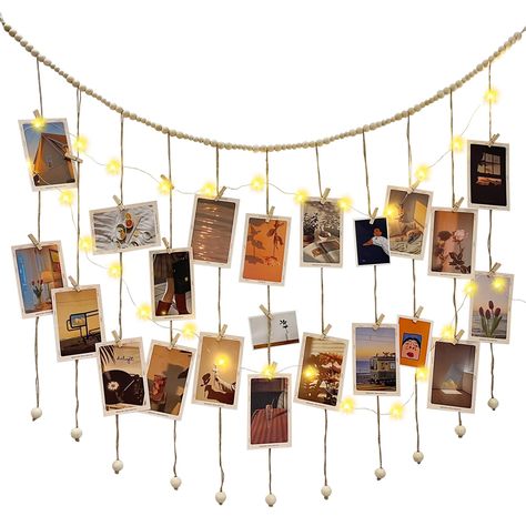 PRICES MAY VARY. PHOTO DISPLAY: Each hanging photo display clip comes with 40 clips. It is up to you how you want to display your photos. We have also prepared a white transparent bag for you, which you can use to hold the battery box to make the whole thing more harmonious, and you can also use it to organize the clips WARM LIGHTING: Warm color string lights add a warm and romantic atmosphere to your house. The combination of light string and photo string with clip is a great decoration for you Boho Collage, Hanging Photo Display, Photo String, Wood Clips, Battery Powered Light, Wooden Bead Garland, Light String, Warm Lighting, Transparent Bag