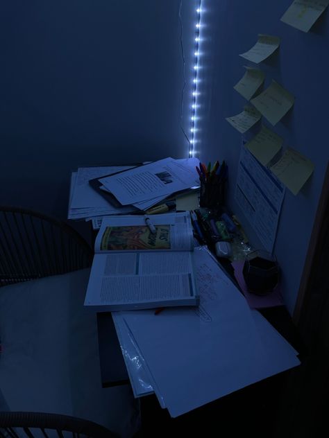 study material set up on a desk with post it notes on the wall and led lights in the background Blue Work Aesthetic, Navy Blue Study Aesthetic, Midnight Study Aesthetic, Dark Blue Study Aesthetic, Mindmaps Aesthetic, Study Blue Aesthetic, Studying At Night Aesthetic, Dark Blue Study, Dark Academia Aesthetic Study