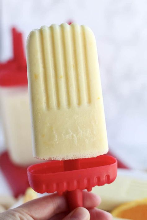 Fun and easy to make, these Healthy Orange Creamsicle Popsicles combine your favorite orange and vanilla dessert flavors in a much healthier no bake summer treat or snack! Made with orange juice, Greek yogurt, vanilla, orange zest, and naturally sweetened with honey. My kids LOVE these homemade Popsicles, and I bet yours will too! Yogurt Popsicle Recipes, Dessert Flavors, Vanilla Dessert, Homemade Fruit Popsicles, Best Greek Yogurt, Healthy Popsicle Recipes, Vanilla Desserts, Snack Balls, Healthy Popsicles