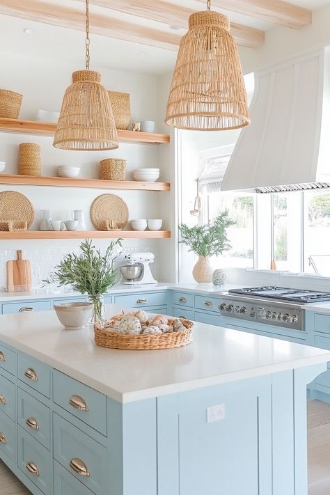 Discover the charm of the latest kitchen design with this serene coastal chic kitchen. Bright blue cabinets, wicker accents, and open shelving create a light, airy space perfect for cooking and entertaining. #kitchendesign #homedecor #coastalliving Boho Bright Kitchen, Coastal Kitchen Appliances, Grandmillenial Style Kitchens, Florida Kitchen Design, California Coastal Interior Design Kitchen, Coastal Boho Kitchen Ideas, Grand Millennial Style Kitchen, Coastal Small Kitchen, Coastal House Kitchen