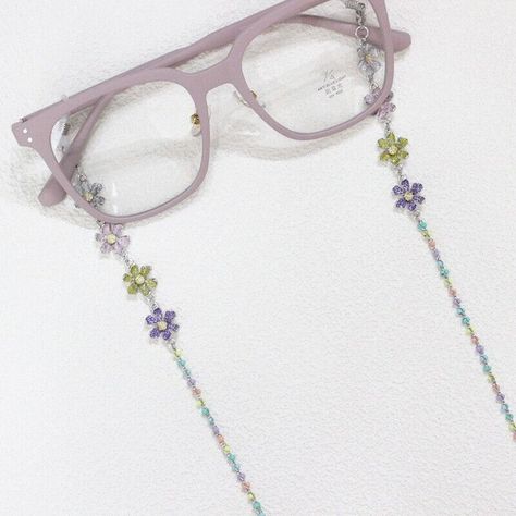 The eyeglass chain features with kinds of beads and the loops which attach to your glasses foot are made by silicone. They are adjustable, so can fit all type of the sunglasses or regular glasses to prevent them from falling off. A fahionable decoration for you, also a great choice as a gift to friends. Material: Plastic beads and Alloy and Silicone Length: About 70 cm Package List: 1* Eyeglass Chain you may have the following questions: 1.when the item will be shipped? normal,we will send in 10 bussiness days. 2.how long it will take to arrive? normal ,it will take about 3-4 weeks to UK,other countries normal will take up to 7 weeks. 3.is return accpet? we accpet return,if you have any problem with the receied item,pls contact us  4.item does not come after purchase quite a long time ? pl Eyeglasses Strap Beads, Sun Glasses Decoration Ideas, Beads Glasses Chain, Glasses Chain Fashion, Diy Glasses Chain, Glasses Chain Aesthetic, Eye Glass Chain, Crochet Lanyard, Beaded Glasses Chain