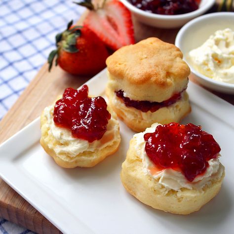 Classic Scones with Clotted Cream and Jam Scones For Tea Party, Clotted Cream And Scones, Scone Jam And Cream, Tea Party Biscuits Scone Recipes, Scones With Clotted Cream And Jam, Scones Clotted Cream And Jam, Tea Party Scones And Jam, Clotted Cream Recipes, Sour Cream Scones