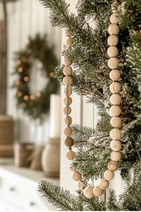 The Ultimate Guide to Farmhouse Christmas Tree Decorating on a Budget.  Learn where to shop, what to DIY, and how to create that cozy, vintage-inspired look without overspending. Perfect for budget-conscious decorators! Some of the links in my articles are affiliate links. If you make a qualified purchase from one of my links I will make a small commission at no cost to you. Thank you for your support!!! Christmas Tree With Wooden Beads, Christmas Tree Wooden Garland, Diy Farmhouse Christmas Tree, Christmas Tree On A Budget, Christmas Tree Decorating, Farmhouse Christmas Tree, Wooden Bead Garland, Farmhouse Holiday, Holiday Tablescapes