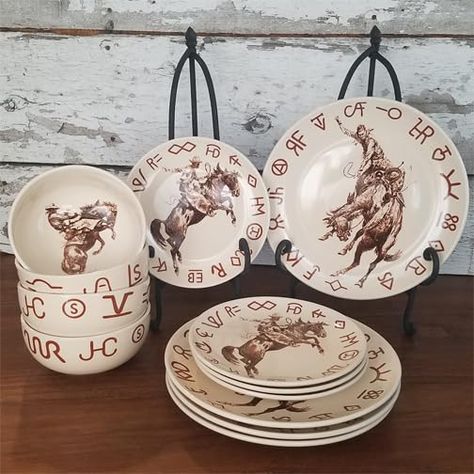 PRICES MAY VARY. Western Cowboy Dinnerware Set with Ranch Brands and Classic Western Images of Bucking Broncs Broncs & Brands 12 Piece Dinnerware Set by Cowboy Living -- Inspired by the artwork of the American West. This is restaurant quality durable porcelain that is dishwasher and microwave safe. The base color is cream. This set includes four 11 inch dinner plates, four 8-1/2 inch side plates, and four 28 ounce dinner bowls. Western Dinnerware Sets, Western Plates Dinnerware Sets, Cowboy Kitchen Decor, Western Dishes Sets, Western Plates, Ranch Glam, Western Dining Table, Cowboy Kitchen, Western Dining Room