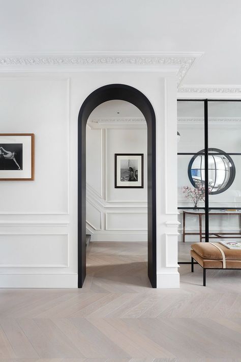 Bespoke Chelsea Townhouse: Matte black archway, Crittall wall, chevron floors & panelled walls Black Archway, Archways In Homes, Chelsea Townhouse, Neoclassical Interior, Corner Sofa Design, London Interior, Arched Doors, Wooden Floors, Contemporary Home Decor