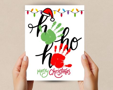 Celebrate this Christmas season with this Handprint craft Christmas printable. This handprint art is designed to bring creativity to your home, classroom, or craft time. This Ho Ho Ho Handprint Art is a great Christmas Decoration or gift. Whether you're a parent or teacher these charming handprint designs will make your Holiday decorations special and personalized. Great toddler handprint activity and homeschool craft.  What's Included:  High-Resolution PDF Files: File is design in high-resoluti Kid Handprint Christmas Crafts, Hand Feet Christmas Crafts, Christmas Hand Prints For Toddlers, Hand Paint Christmas Crafts, Handprint Christmas Bauble, Seasonal Handprint Art, Christmas Hand And Footprint Ideas, Baby Christmas Crafts Footprint, Baby Canvas Painting Ideas Hand Prints Christmas