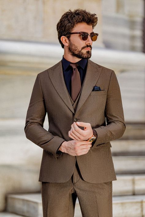 Elevate your formal attire with the Brown Slim-Fit Suit 3-Piece. This suit’s rich brown color and sharp, tailored fit provide the perfect balance of tradition and modernity, ensuring you stand out in any setting.  #brownslimfitsuit #elegantmenswear #classylook #formalfashion #modernfit #tailoredsuit #professionalstyle #sharpdressing #businessattire #menssuit Brown Suit Combinations Mens Fashion, Black And Brown Suit, Brown Suit Men, Light Brown Hair Men, Brown Suits For Men, Black Double Breasted Suit, Urdu Vocabulary, Classic Mens Hairstyles, All Black Suit