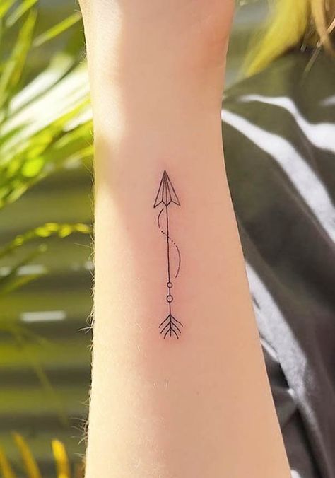 Bent Arrow Tattoo, Arrow Wrap Around Tattoo, Delicate Arrow Tattoos For Women, Tiny Arrow Tattoos For Women, Arrow Infinity Tattoo Design, Wrist Arrow Tattoos For Women, Small Tattoos Strength, Minimalist Strength Tattoo, Fine Line Arrow Tattoo Design