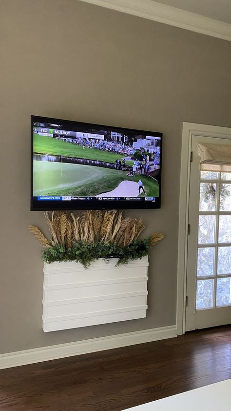 TV hanging on the wall with planter hiding the wires Cable Cover Ideas Wall, Tv Wire Hiding Ideas, Hide Tv Cords On Wall, Hiding Tv Cables, Hiding Tv Cords On Wall, Hide Thermostat, Hide Tv Cords, Hide Cable Box, Fake Walls