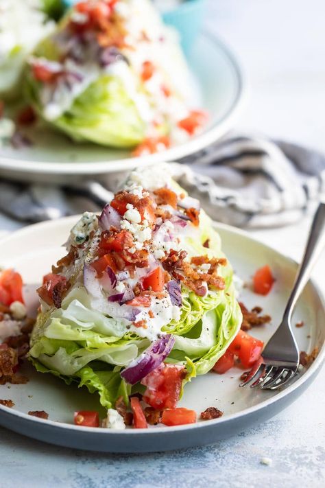 Inspired by the classic steakhouses, this Iceberg Wedge Salad is smothered in creamy blue cheese dressing and topped with bacon, tomatoes, and more blue cheese crumbles. Iceberg Wedge Salad, Iceberg Salad, Wedge Salad Recipes, Lettuce Wedge, Blue Cheese Dressing Recipe, Cabin Food, Cheese Wedge, Wedge Salad, Red Onion Salad