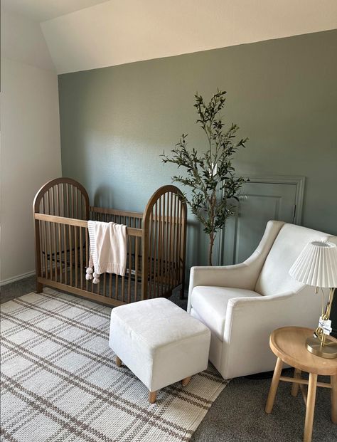 Dark Furniture Nursery Boy, Mixed Woods Nursery, Nursery Dark Carpet, Sage And Brown Nursery, Green And Natural Wood Nursery, Clean Nursery Ideas, Magnolia Home Nursery, Nursery With Walnut Crib, Army Green Nursery