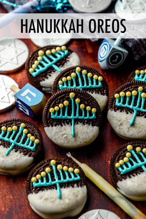 These adorable Oreos are the perfect Hanukkah treat! Store bought Oreo cookies are dipped into melted white chocolate, decorated with a simple menorah, then dotted with colorful beads to finish off the candles. These chocolate dipped Hanukkah Oreos are the perfect easy holiday dessert recipe. | Hanukkah chocolate covered Oreos | Hanukkah cookies decorated | Hanukkah cookies recipe | Hanukkah cookies aesthetic Hanukkah Snacks For Kids, Hannukah Charcuterie, Hanukkah Cookies Decorated, Chrismukkah Party, Hanukkah Party Food, Hanukkah Treats, Hanukkah Aesthetic, Hanukkah Cookies, Hanukkah Desserts