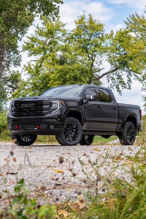 Full view of a 2024 GMC Sierra Denali truck with chrome delete trim, a satin black vinyl wrap, and a lift kit. Gmc Sierra Blacked Out, Custom Gmc Sierra 1500, Black Gmc Truck, Lifted Gmc Sierra 1500, Gmc Sierra Lifted, Gmc Truck Accessories, Gmc Denali Truck, Gmc Car, Hawaii Beach House