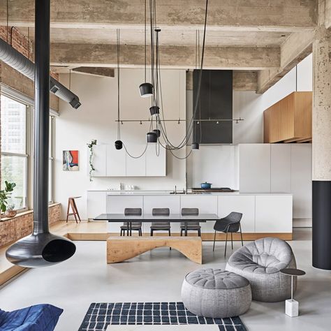 This apartment in Chicago features wood and steel volumes slotted within an exposed concrete structure, designed by local firm Vladimir Radutny Architects. Industrial Livingroom, Sleeping Loft, Exposed Brick Walls, Loft Apartment, Beautiful Living Rooms, Spacious Living, Staircase Design, Home Room Design, 인테리어 디자인