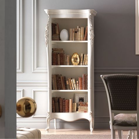 Elegant and refined open bookcase, intended for exclusive and classy home. Shaped shoulders with an evident notch in the upper and lower part. Shaped hat with frame and base raised from the ground by feet ending in a curl. Adjustable shelves on a wooden ladder. The delicate but important shapes are decorated with richly carved details. This bookcase can be inserted within classic furniture or in a modern context, as a strong contrasting element. It is certainly a piece of furniture destined to l Parisian Bookshelf, Classic Bookshelves, Classic Shelves, French Bookcase, French Country Interiors, Bookshelf Aesthetic, Living Classic, Classy Home, Country House Interior