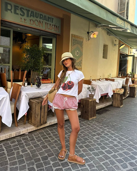 credits:@keziacook (From Instagram)  🍒 Summer chic with a cherry twist! Loving the combo of a fun cherry tee, gingham shorts, and cozy sandals. Perfect for sunny strolls and stylish vibes. 🌞✨  #SummerStyle #ChicVibes #GinghamLove #CasualCool #SunnyDays Gingham Shorts Outfit Summer, Gingham Shorts Outfit, Italy Mood Board, New York Minute, Summer Shorts Outfits, Gingham Shorts, Fall 2024 Fashion, 2024 Fashion Trends, Don Juan